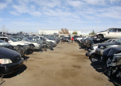 A to Z junk yard, stack of used cars.