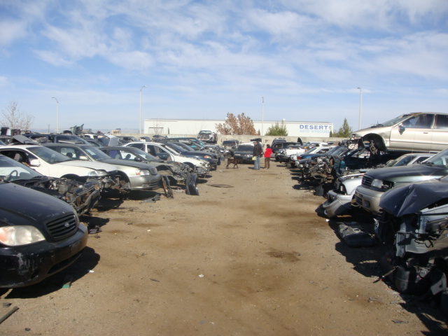 Salvaged cars stacked on top of eachpther