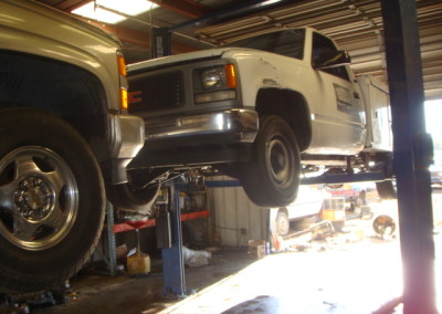 GMC truck lifted to be dismantled in A to Z auto plaza